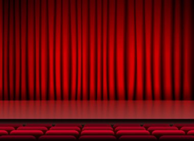 Kırmızı perdeleri ve koltukları olan oditoryum sahnesi.