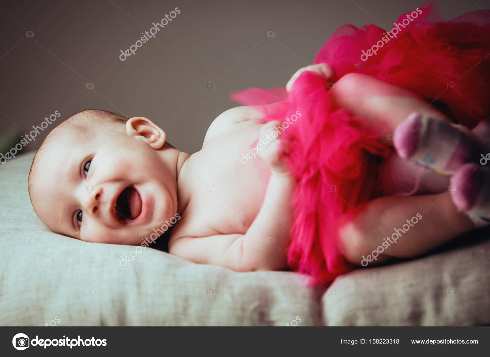 baby laughing at 1 month