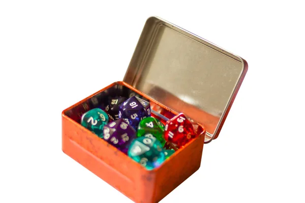 A lot Dices for board games in orange box, isolate on white