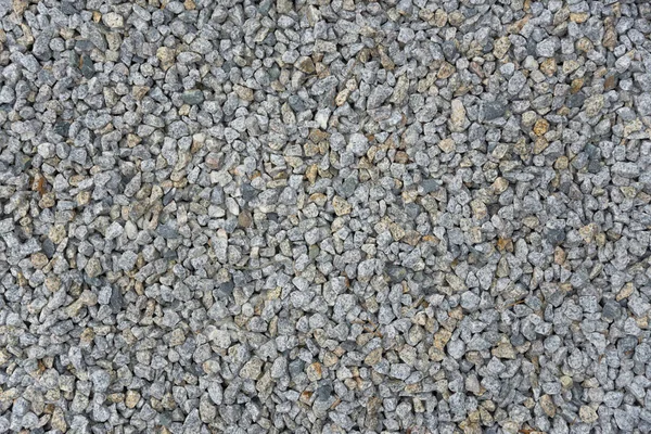 Тонка рівна текстура гравію з різнокольоровими каменями — стокове фото