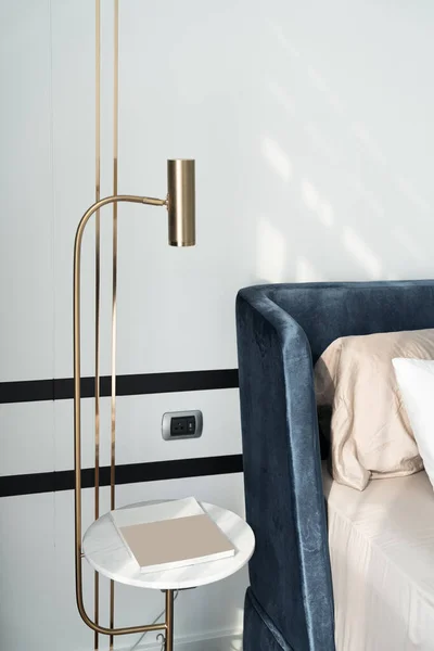 Bedroom Corner Navy Blue Velvet Bed With Soft Pillows Setting Decorated With Circular Marble Night Table And Navy Blue Paint Wall In The Background Cozy Interior Design Stock Images Page Everypixel