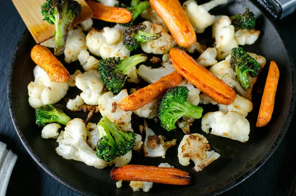 fried vegetables in a pan, vegetarian food, grilled vegetables, fried broccoli cabbage and carrots in a pan