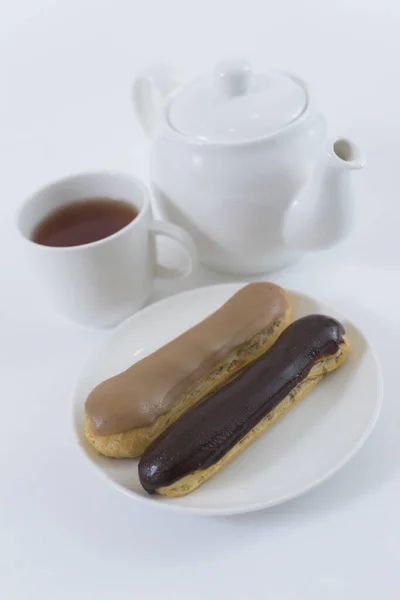 Two Eclairs Cup Tea Close — Stock Photo, Image