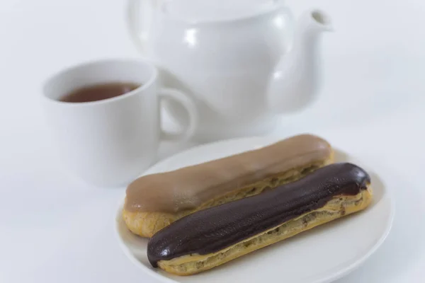 Two Eclairs Cup Tea Close — Stock Photo, Image