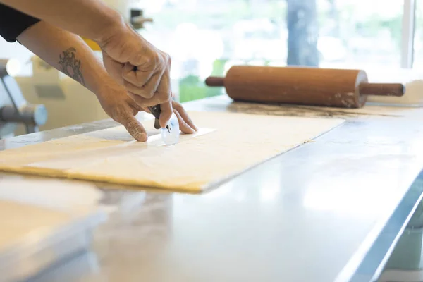 Man Kitchen Cutting Dough Croissant — Stock Photo, Image