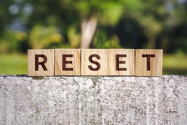 Reset Word op Houten Blok Stockfoto