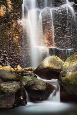 Water Flows Down The Cascade Waterfall