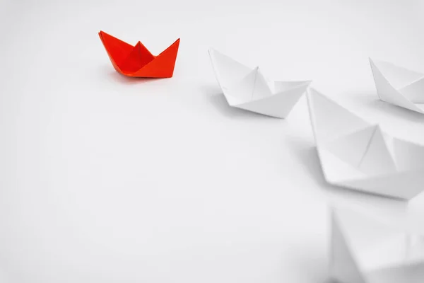 Business and Leadership. Unique Paper Boat Leading The Rest By Example.