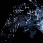 Smoke  on a black background, abstract photo with swirls in the air