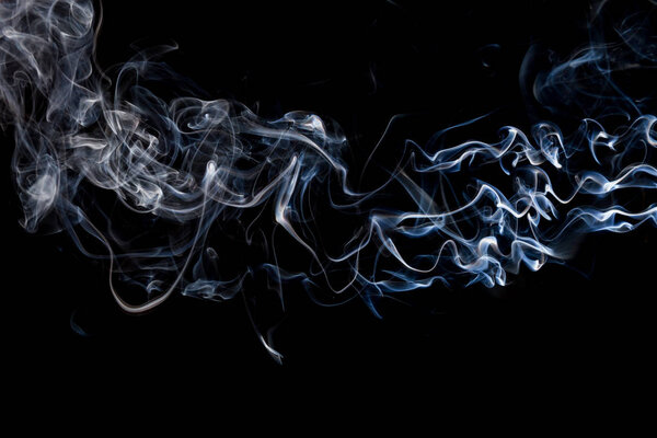 Smoke  on a black background, abstract photo with swirls in the air