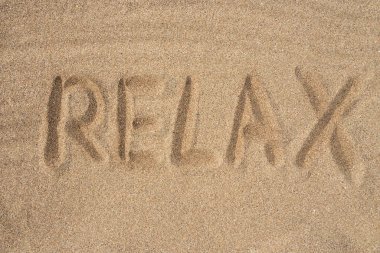 The inscription relax on the sea sand