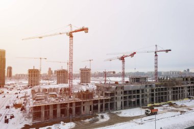 MOSCOW, RUSSIA - JANUARY 12, 2020:  Construction of monolithic houses, high tower cranes, winter day