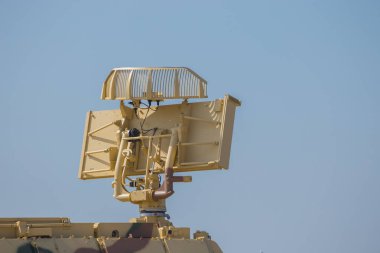 military antenna locator protective sand color on an armored personnel carrier