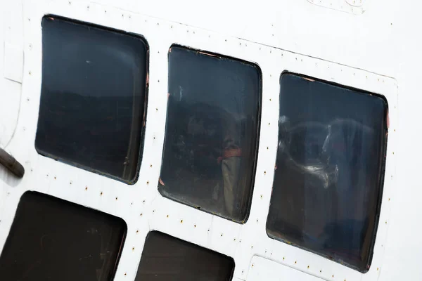 Square Windows Portholes Aircraft Body Part Fuselage Rivets Bolts Illuminated — Stock Photo, Image
