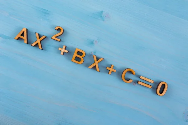 Quadratic Equation Laser Cut Plywood Blue Wooden Background — Stock Photo, Image