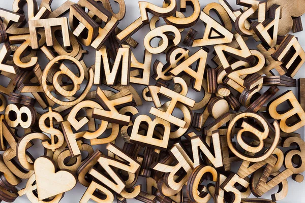 Abstract illustration with letters, alphabet made of plywood cut with laser