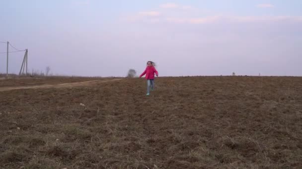 Teenager Girl Runs Spring Field Grass Smiles Early Spring — Stock Video