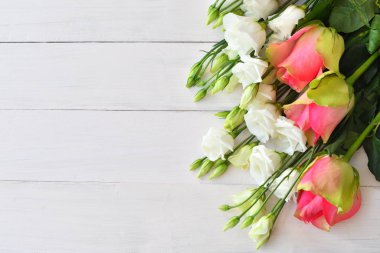 Valentine card.Template greeting card for Valentine's Day with white eustomas and pink roses. Spring card for Mother's Day, Women's Day. Copy space. Congratulations on wedding or anniversary. March 8