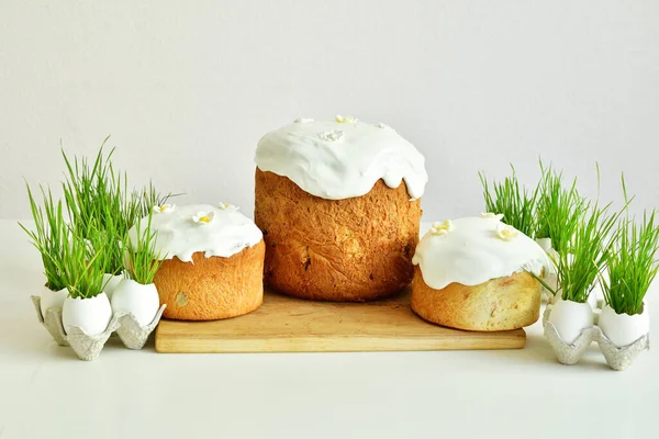 Easter orthodox sweet bread, Easter cake with flowers and gingerbread. Holidays breakfast concept with copy space. Easter greeting card template. Homemade pasques.Easter sweets on white background.