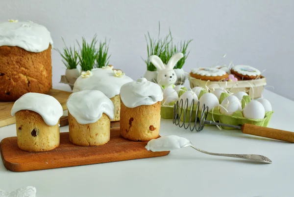 Easter sweet bread, Easter cake with green grass. Holidays breakfast concept with copy space. Easter greeting card template. Homemade pasques.Easter sweets on white background.