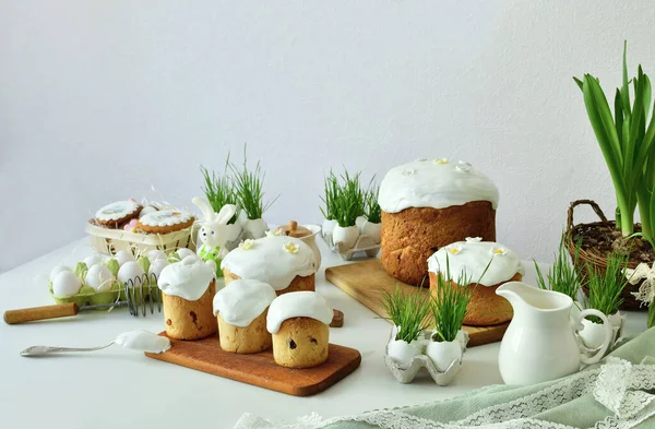 Easter sweet bread, Easter cake with green grass. Holidays breakfast concept with copy space. Easter greeting card template. Homemade pasques.Easter sweets on white background.