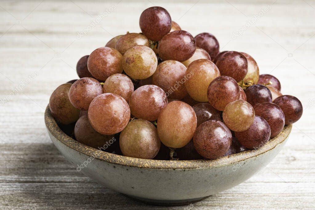 Grapes In A Bowl On Wood Table