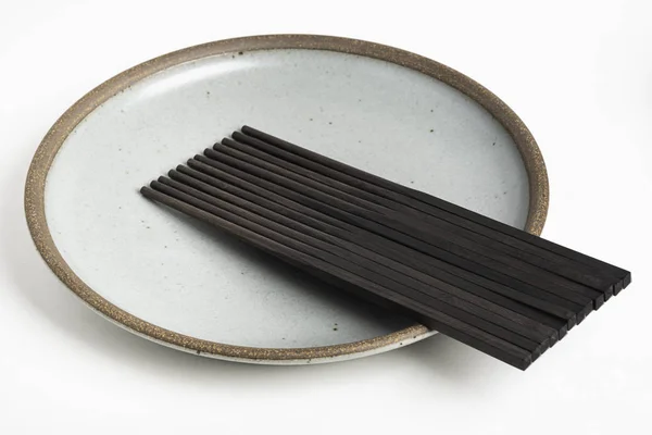 stock image Six Pairs Of Chopsticks On Stoneware Plate