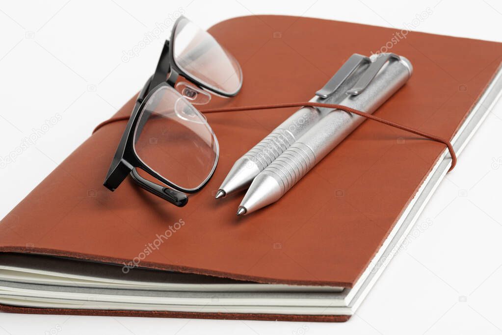 Red Leather Journal Cover With Pens And Glasses
