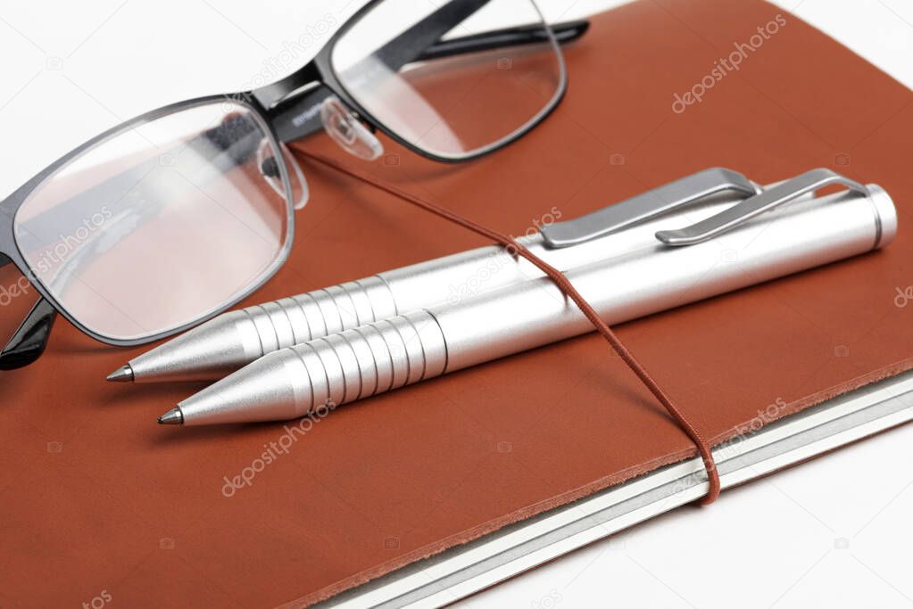 Red Leather Journal Cover With Pens And Glasses