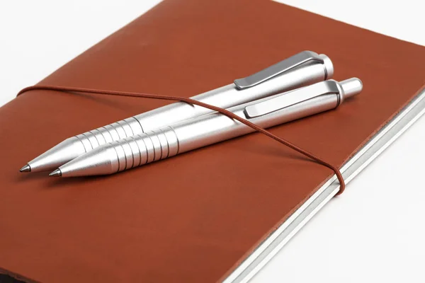 Red Leather Journal Cover with Two Ballpoint Pens — стоковое фото