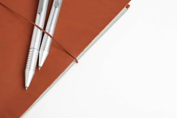 Red Leather Journal Cover with Two Ballpoint Pens — стоковое фото