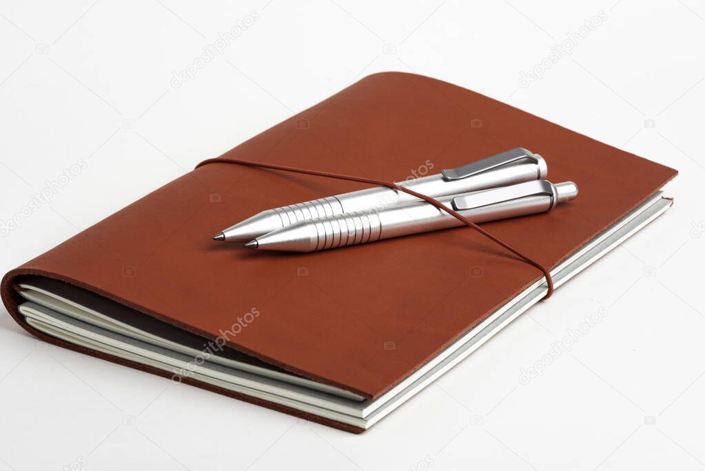 Red Leather Journal Cover With Two Ballpoint Pens