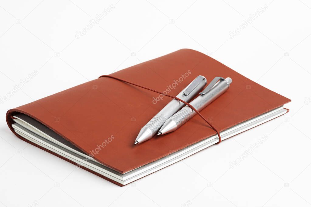 Red Leather Journal Cover With Two Ballpoint Pens