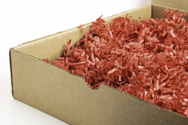 Package Box With Red Paper Strips Filling