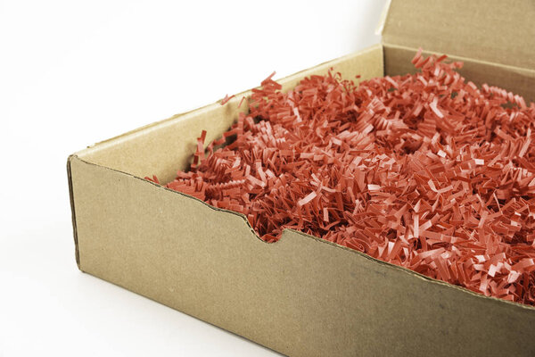 Package Box With Red Paper Strips Filling