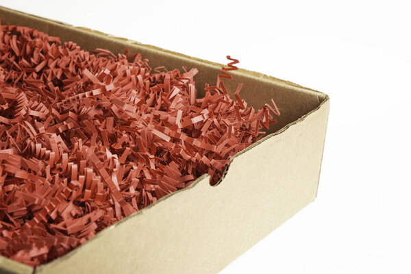 Package Box With Red Paper Strips Filling