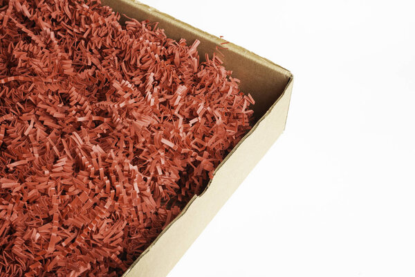 Package Box With Red Paper Strips Filling