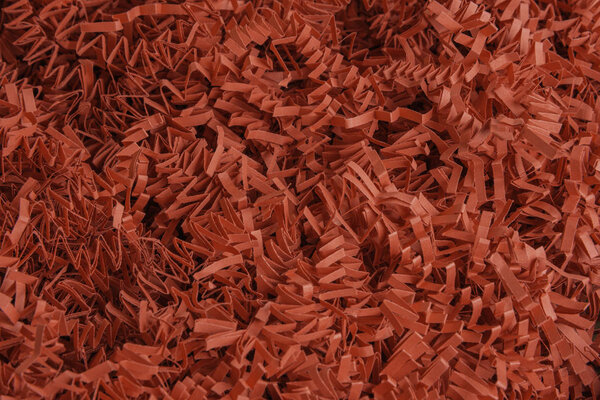 Red Paper Strips Filling From A Package Box