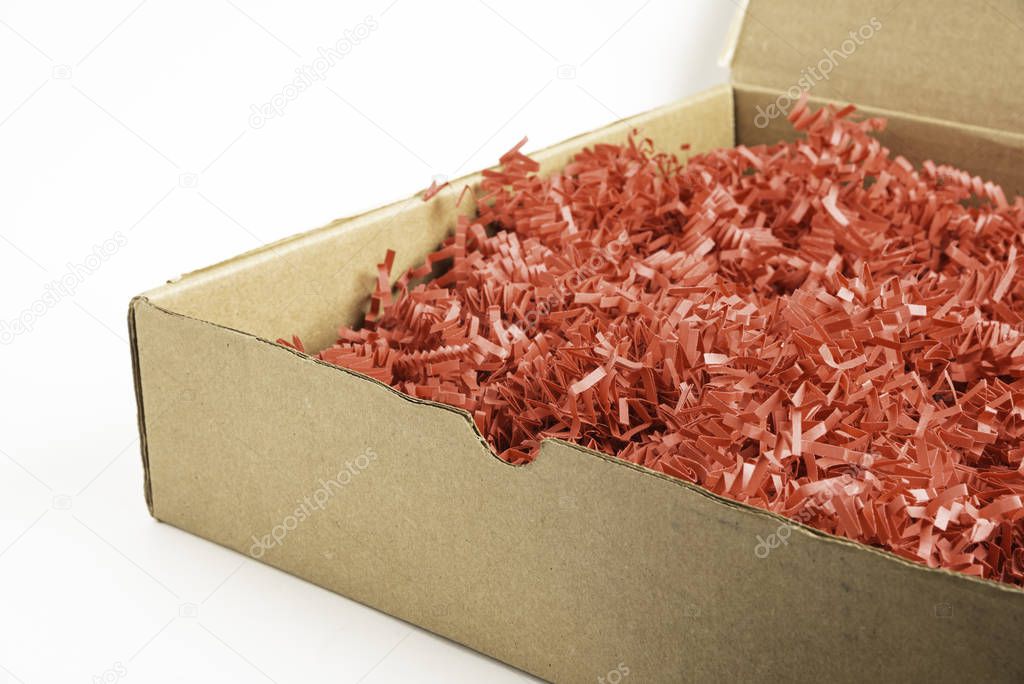 Package Box With Red Paper Strips Filling