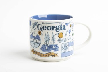 A Starbucks Signature Mug With Georgia Iconic Designs