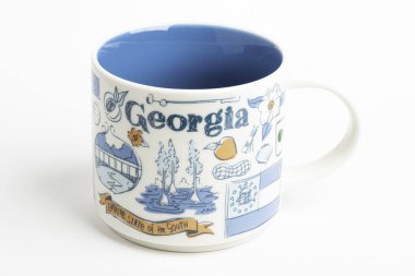 A Starbucks Signature Mug With Georgia Iconic Designs