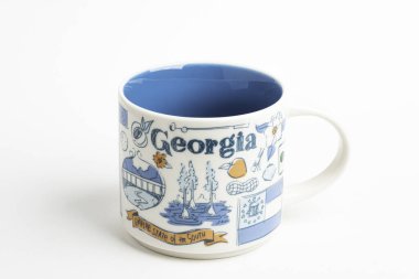 A Starbucks Signature Mug With Georgia Iconic Designs