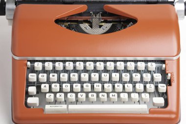Portable Manual Typewriter In Red Orange clipart