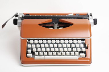 Portable Manual Typewriter In Red Orange clipart