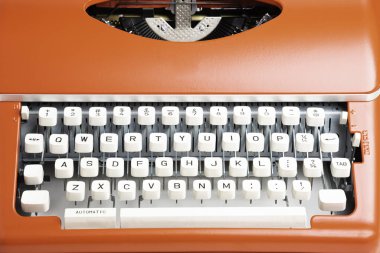 Portable Manual Typewriter In Red Orange clipart