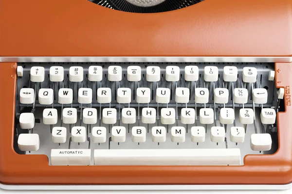 Φορητό εγχειρίδιο γραφομηχανή σε κόκκινο πορτοκαλί — Φωτογραφία Αρχείου