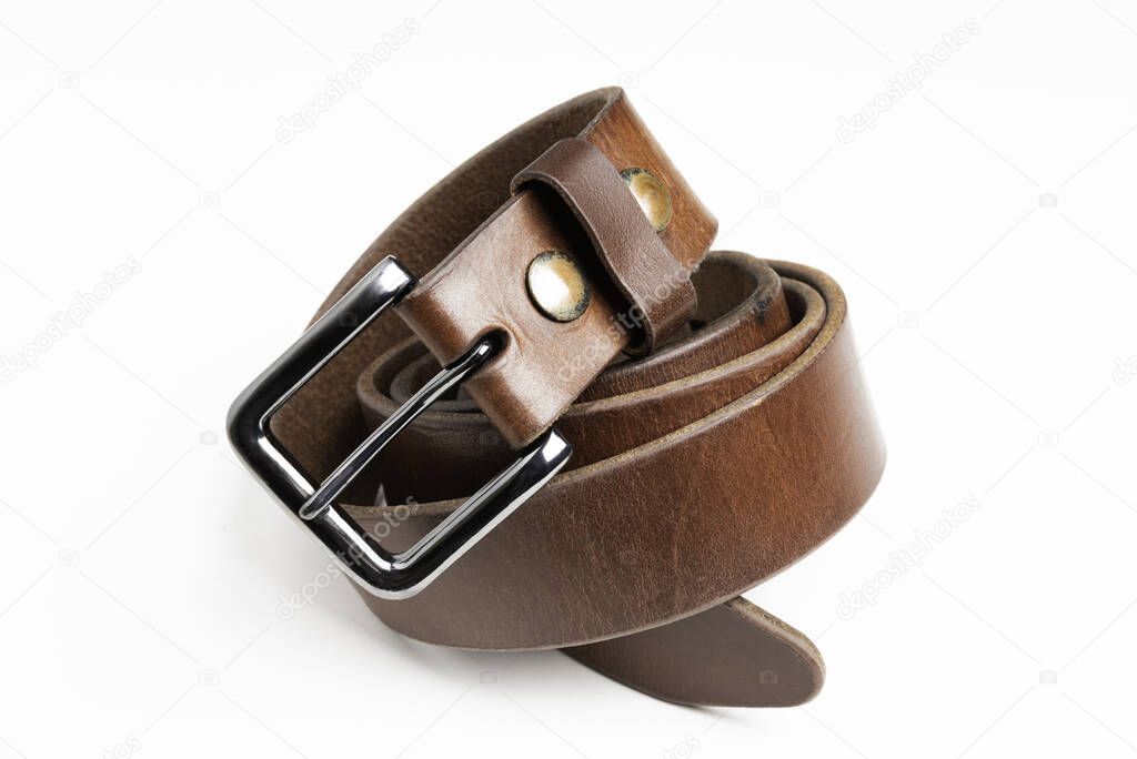 A formal studio product shot of a men's used brown leather belt with patina set on plain white background.