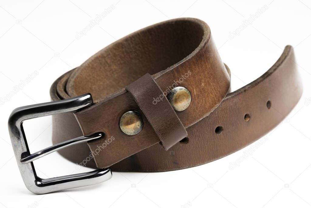 A formal studio product shot of a men's used brown leather belt with patina set on plain white background.