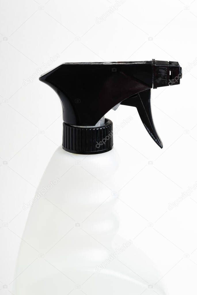  A close-up of the top portion of a black-and-white liquid spray plastic dispenser bottle set on a plain white background.