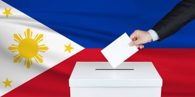 Filipinler 'de seçim. Oylarını sandığa koyan adamın eli. Arka planda sallanan Filipinler bayrağı.                               